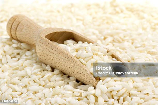 Risotto Rice With Wooden Scoop Stock Photo - Download Image Now - Rice - Food Staple, 2015, Agriculture