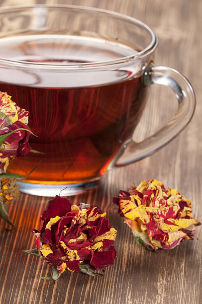 istock Cup of tea and dry roses 470811294