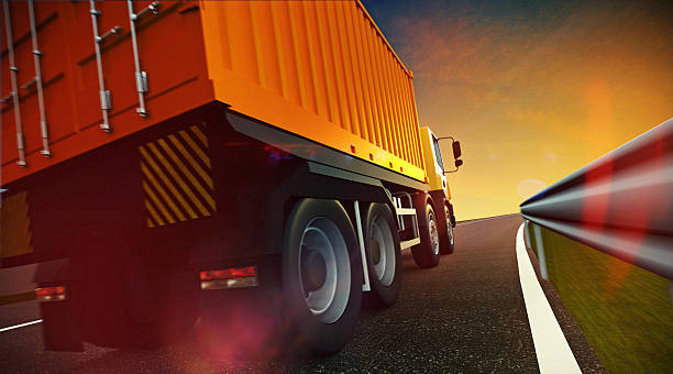 istock A dump truck driving toward the sunset 470811330