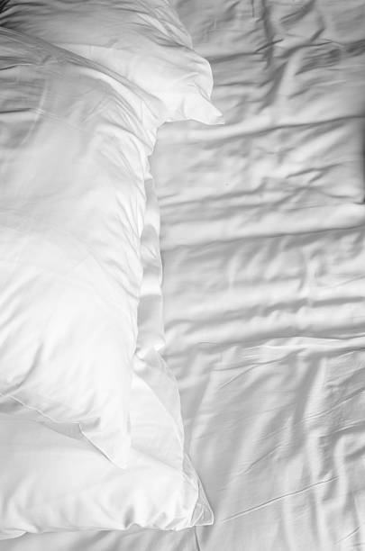 istock Bed sheet pillows and blanket messed up in the morning 470811404
