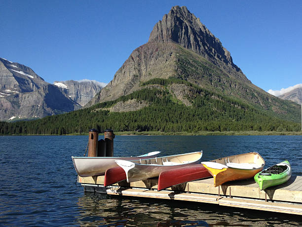 istock Kayaks and Canoes by the Mountainside 470815830