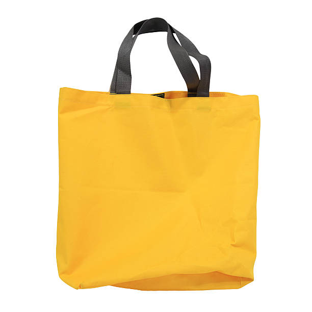 istock yellow canvas shopping bag isolated on white 470815902