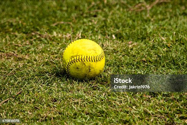 Baseball On The Grass With The Field Beyond Stock Photo - Download Image Now - 2015, Baseball - Ball, Baseball - Sport
