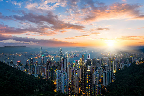 Hong Kong Cityscape skyscraper on two side of Victoria Harbour of Hong Kong. View from the Peak at night. central plaza hong kong stock pictures, royalty-free photos & images