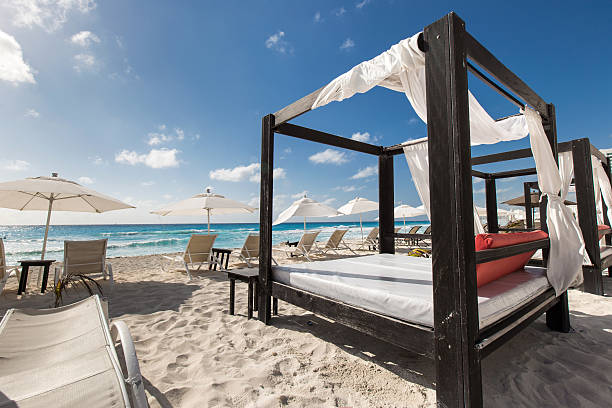 istock Luxury wooden lounge beds on caribbean beach 470816534
