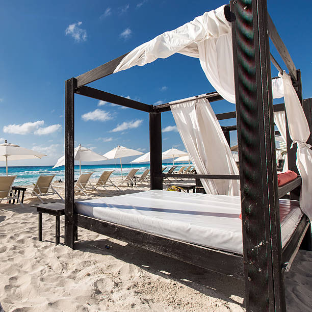istock Luxury wooden lounge beds on caribbean beach 470816538