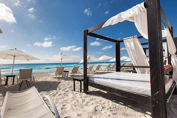 istock Luxury wooden lounge beds on caribbean beach 470816540