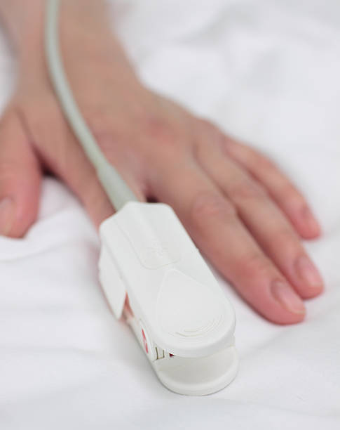 istock pulse oximeter on the patient's hand. Medical background. 470816978