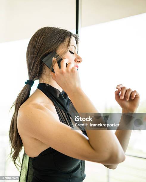 Posh Beautiful Woman On The Phone Inside The Hotel Stock Photo - Download Image Now - 20-29 Years, 2015, 30-39 Years