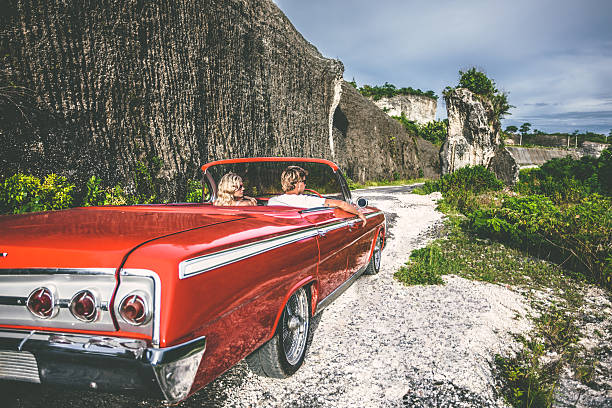 istock Happy young people in convertible car 470818498