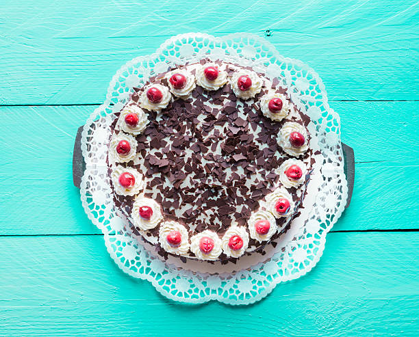 istock Black Forest cake on turquoise wood 470819362