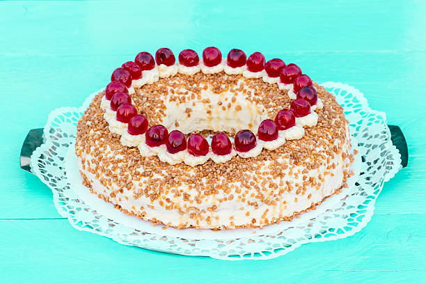 istock Frankfurt crown cake with cherries on a turquoise wood 470819364