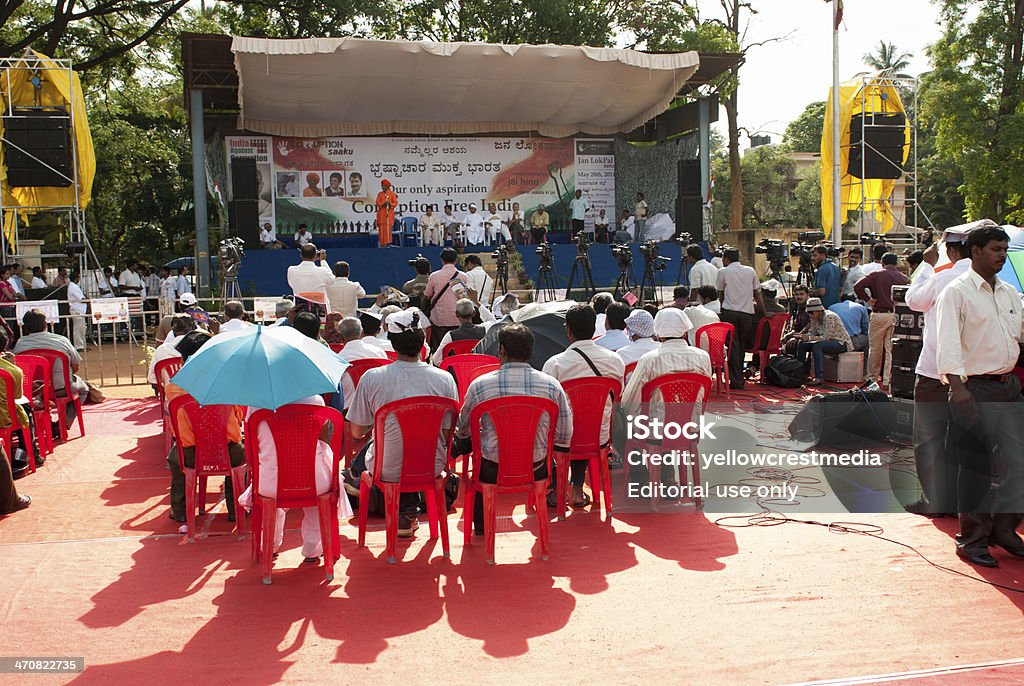 Anti corruption protest in India Bangalore India - May 28, 2011: The safron clad Swami Agnivesh speaks at an Indian protest against corruption in Bangalore. To his left are Kiran Bedi and Arvind Kejriwal and Anna Hazare - the core team of activists who have spearheaded the popular non-political, anti-corruption movement that has caught the imagination of people across the nation. They are championing for a "Jan Lok Pal Bill" - people's participation in an anti corruption bill to be tabled in parliament soon. India Stock Photo