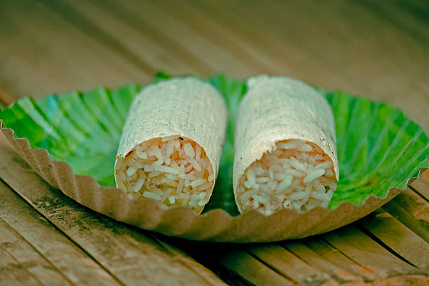 Rice steamed in bamboo tube served in a paper dish, Miao, arunachal Pradesh, India. Rice Cooked in Bamboo Tubes, also called Bamboo Rice or Fragrant Bamboo Rice, is a type of roasted food consisting of rice and some spices, contained in a bamboo tube. Generally, it is made by people who live in mountainous regions.