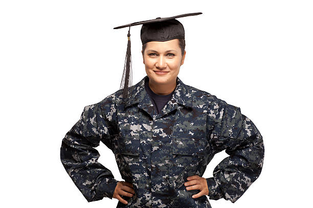Navy sailor wearing graduation cap