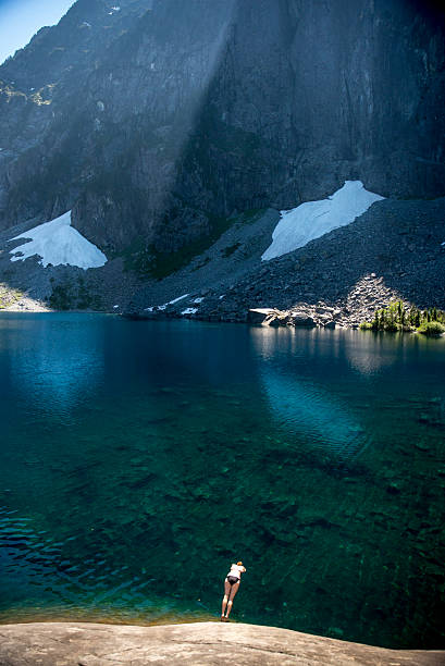 Woman Diving Into a Lake stock photo