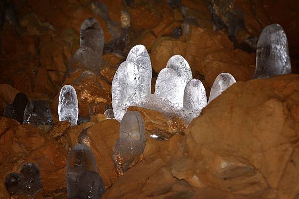 istock Structure of a thawing ice stalagmite in a cave. 470825270