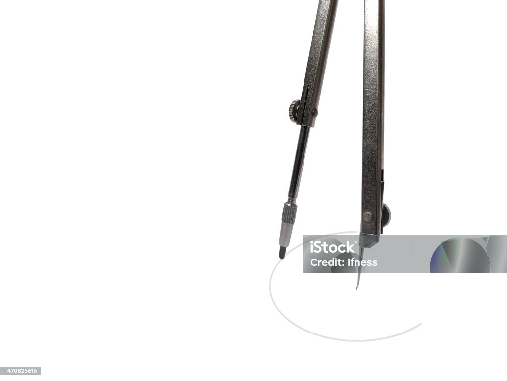 Old fashioned pair of compasses drawing a circle Old fashioned pair of compasses drawing a circle isolated on white 2015 Stock Photo