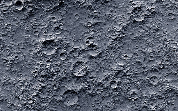 A picture of the moons surface that contains craters stock photo