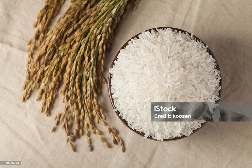 Raw rice Raw rice in a brown bowl Agriculture Stock Photo