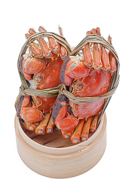 istock Hairy crabs on the Bamboo steamer Isolated in white background. 470828176