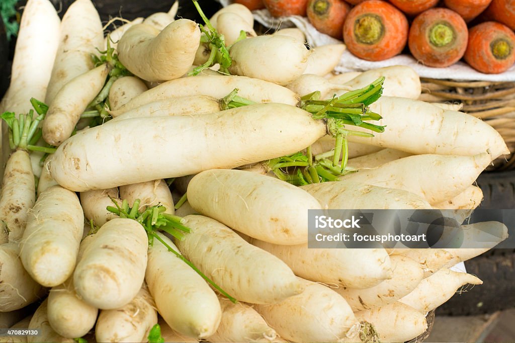 Close-Up Of White Radish And Carrot Close-Up Of White Radish And Carrot In The Market 2015 Stock Photo