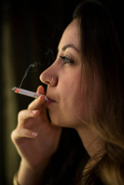 istock Smoking cute girl. 470830970