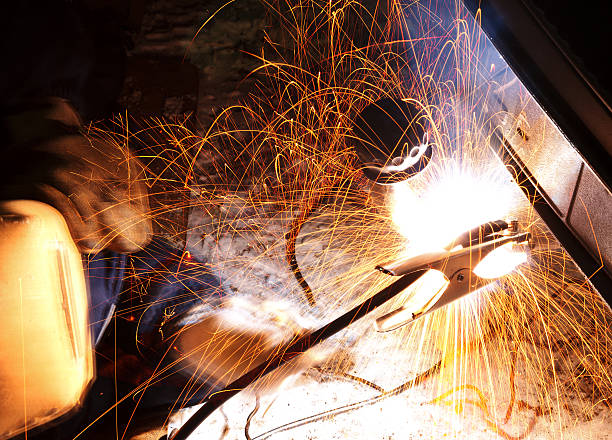 istock car repairs by welding in field 470831921