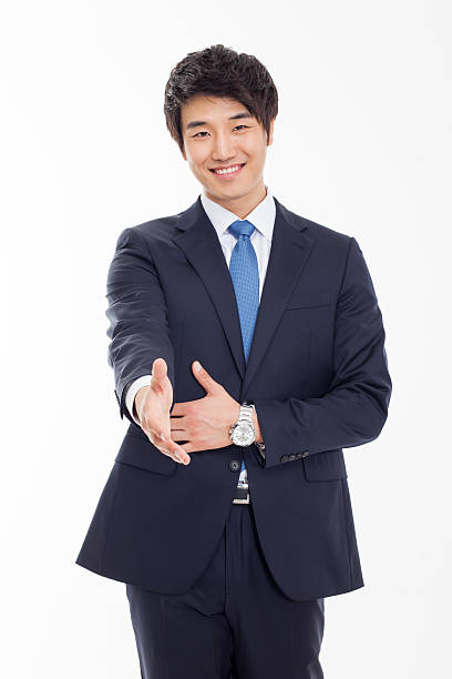 istock Young business man extending hand to shake 470832047