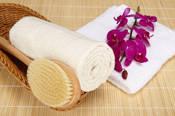 istock Bath brush and rolled towel in a basket 470832477