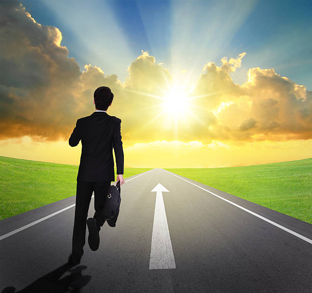istock business man running on asphalt road 470834115