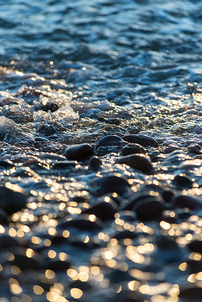 istock Stones on beach and sea water 470835000