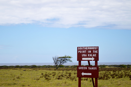 Sign in the Big Island of Hawaii indicating the way to Green Sands Beach and to Ka Lae, also known as South Point, the southernmost point of the US.