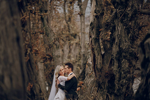 istock bride walking in golden autumn nature 470835356