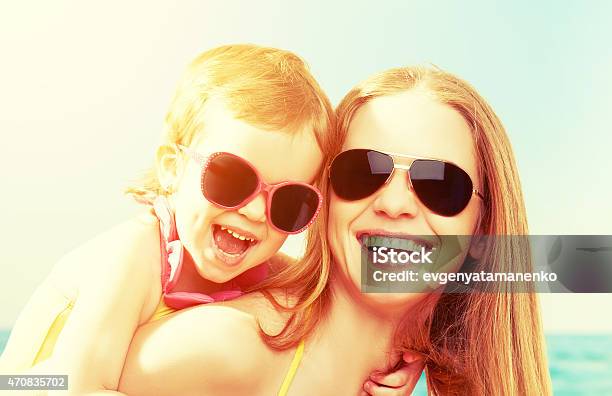 Happy Family On The Beach Mother And Baby Daughter Stock Photo - Download Image Now