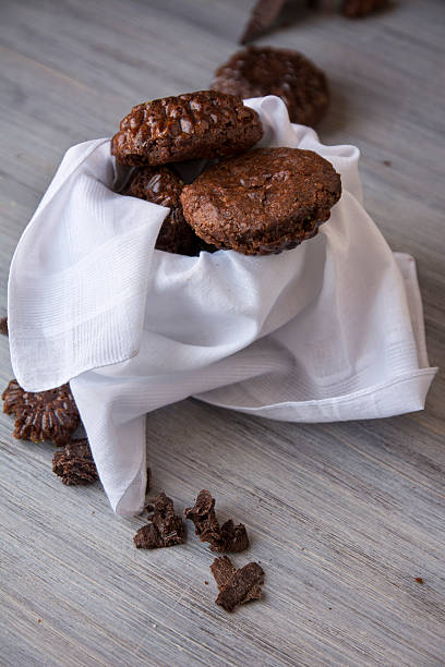 Brownies shaped flower in white bowl Brownies shaped flower in white bowl on green napkin cup shaped flower stock pictures, royalty-free photos & images