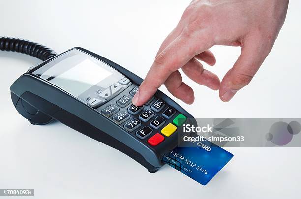 Shopper Making A Purchase On A New Credit Card Machine Stock Photo - Download Image Now