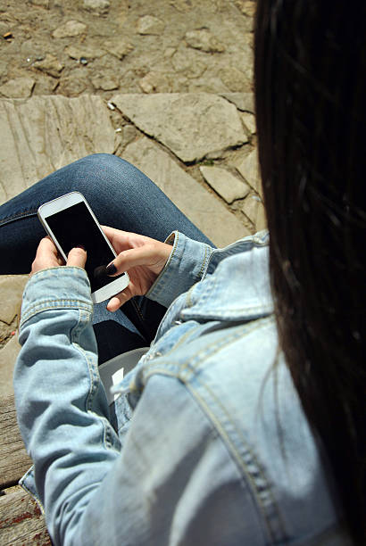 istock Young people watching their mobile phones 470841512