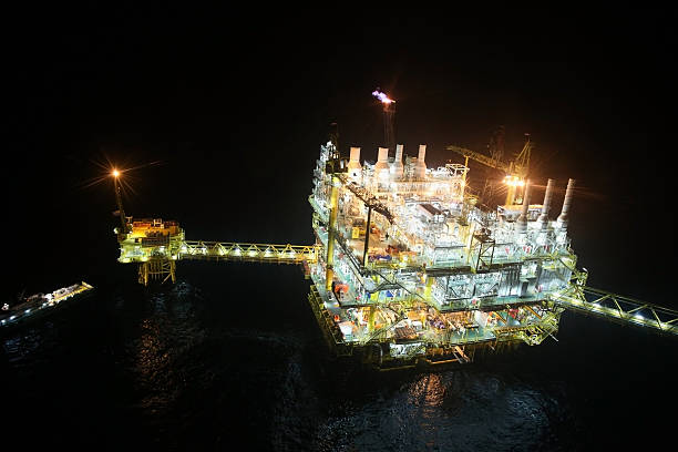 istock oil and gas construction in night view. View from helicopter 470841544