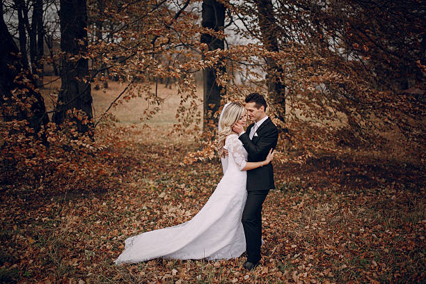 istock bride walking in golden autumn nature 470842190