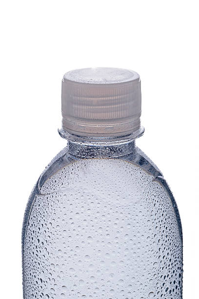 istock Bottle of water with drops isolated on white background. 470842884
