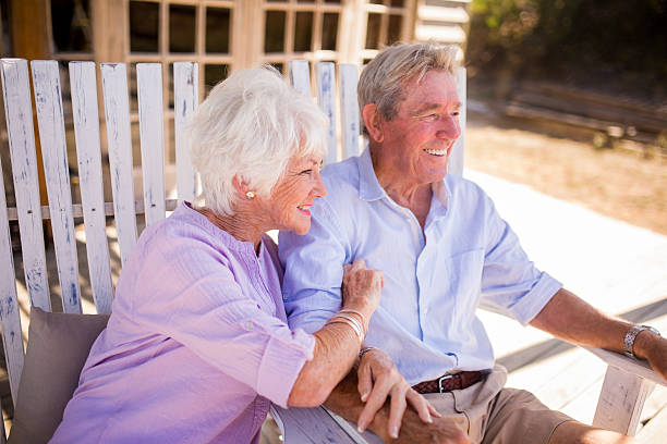 istock Retired senior couple relaxing together on a summer day 470843962