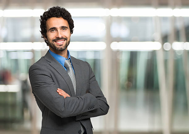 A handsome business man posing for a portrait photograph stock photo