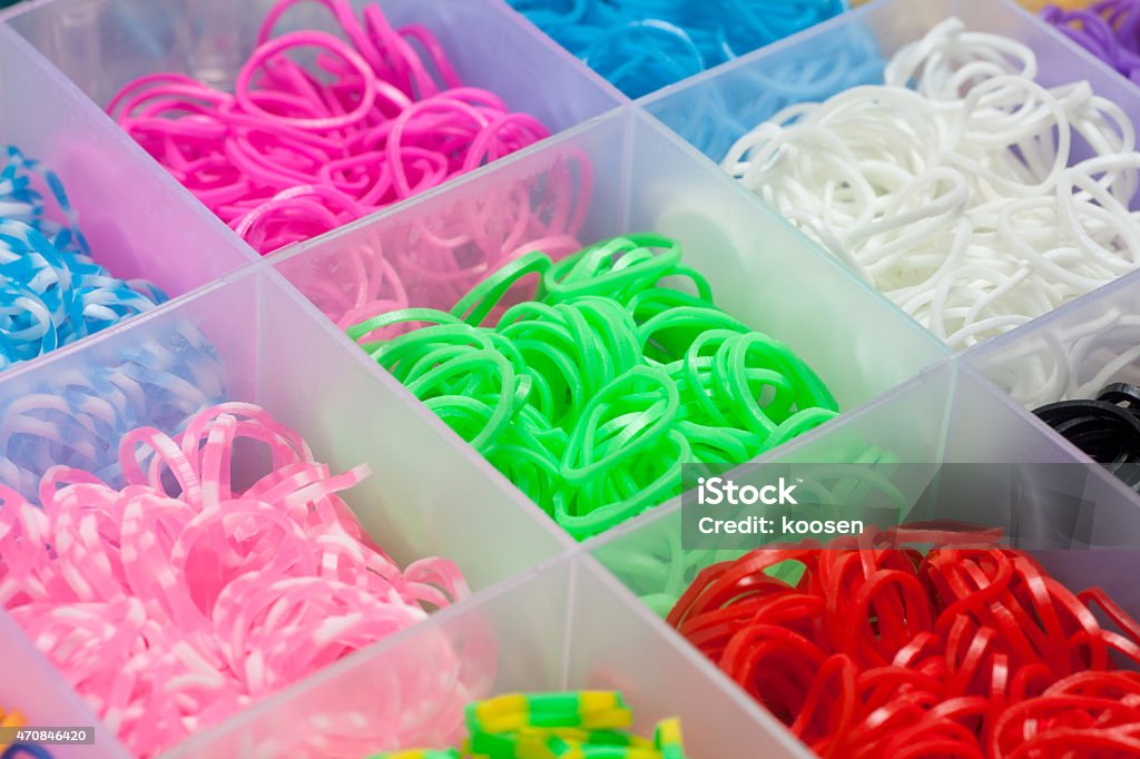 Colored rubber bands Colourful rubber bands in a plastic box, Close-up. 2015 Stock Photo