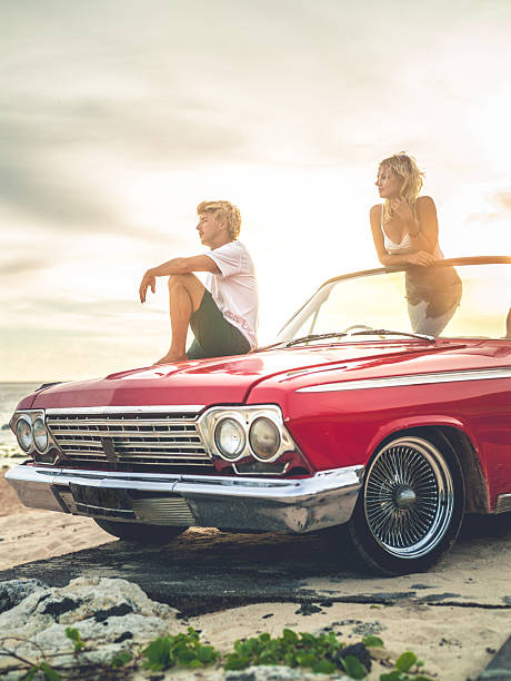 istock Happy young people in convertible car 470846580