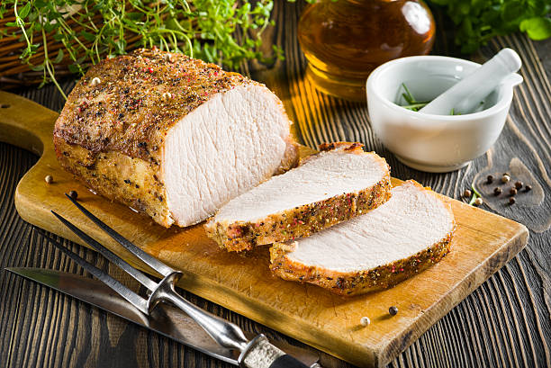 istock Roasted pork loin on the wooden table 470848392