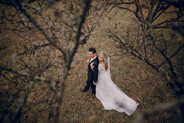 istock bride walking in golden autumn nature 470848646