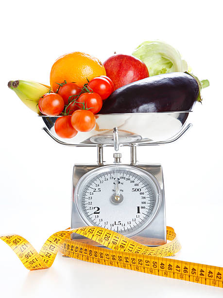 istock Vegetables and fruits on a weighing scale 470848961