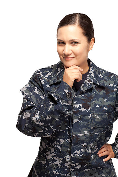 istock Smiling female navy sailor with hand on chin 470850518