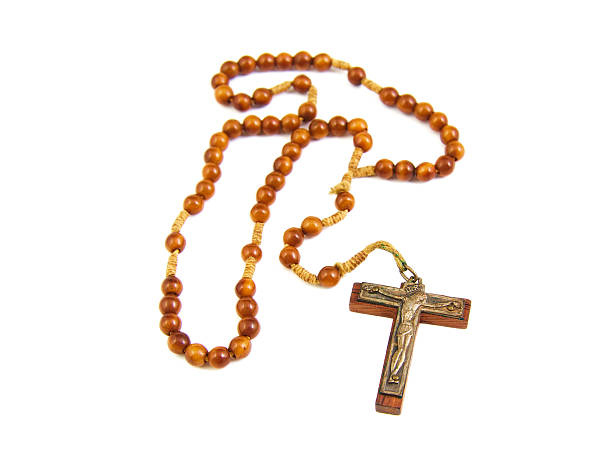 istock Wood rosary and cross with slightly unfocused beads isolated on 470851256
